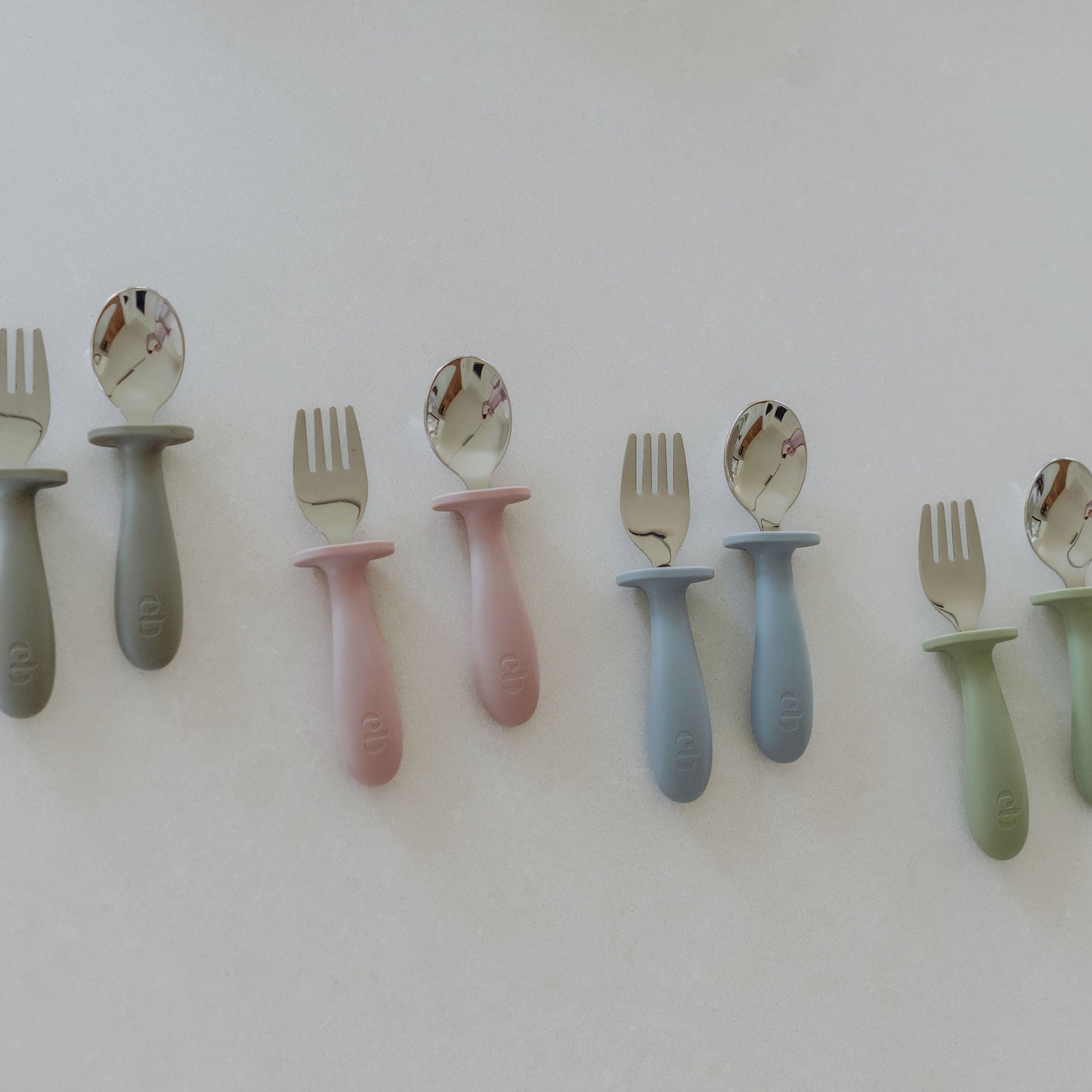 Set of colorful children's cutlery on a white background